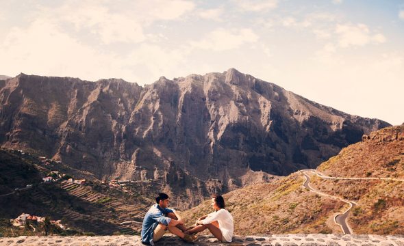 Couple sitting with views of the Masca hamlet and gorge