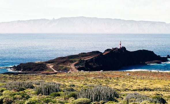View of the lighthouse in Teno Rural Park with La Gomera in the background